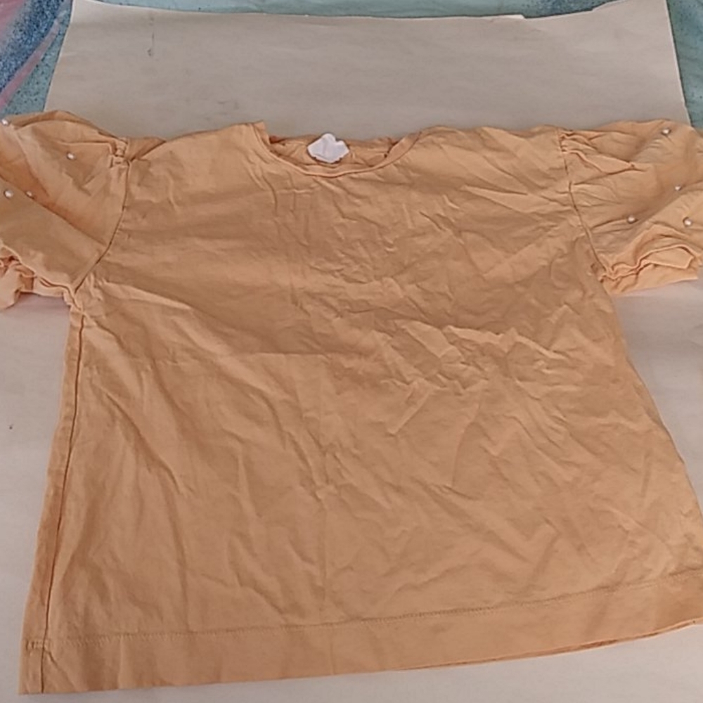 Yellow shirt.